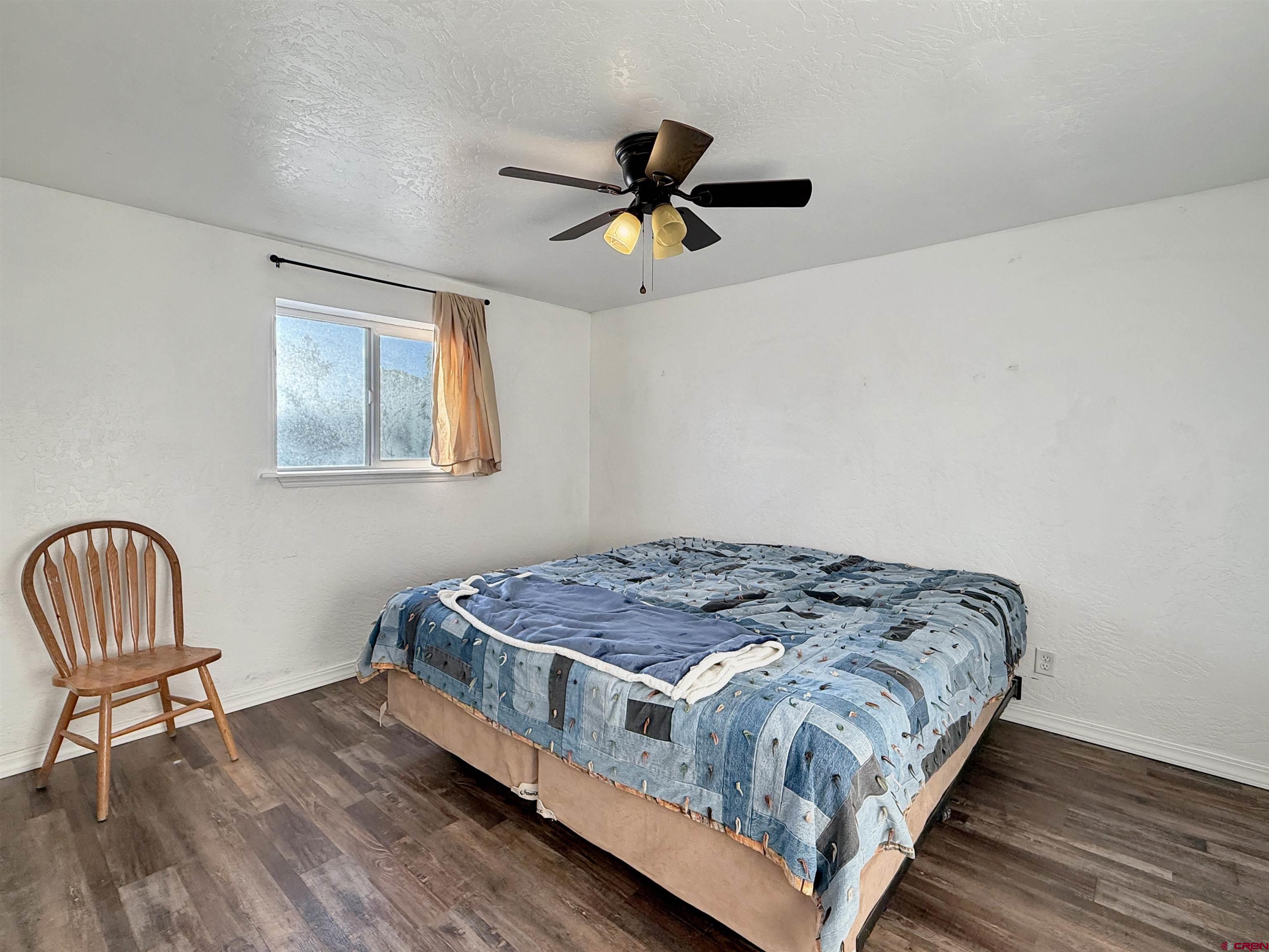 27425 Rd P.7 Dolores, CO 81323 - Photo 33 of 45 a bedroom with a bed and a window