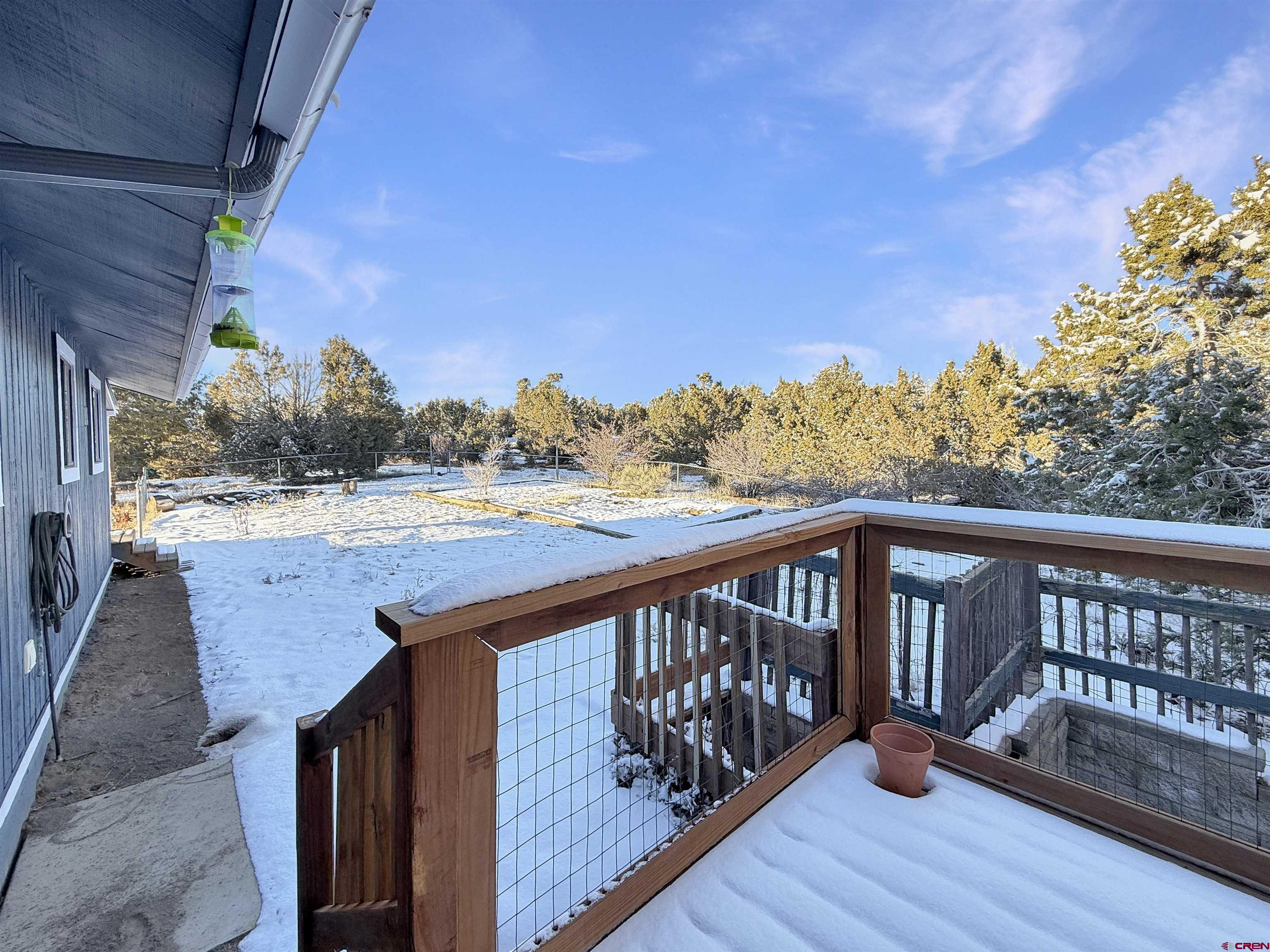 27425 Rd P.7 Dolores, CO 81323 - Photo 36 of 45 a view of a balcony with wooden floor and fence