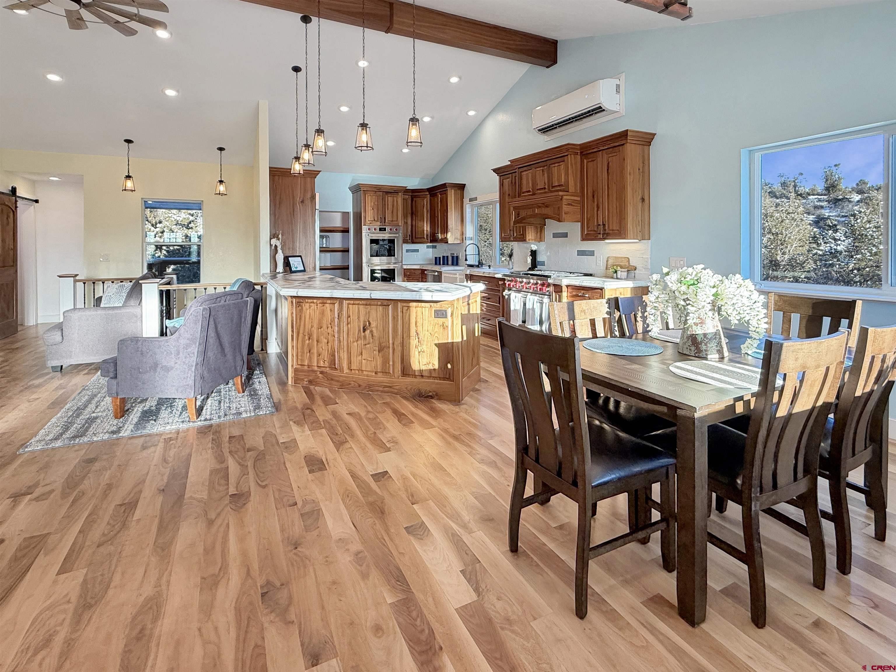 27425 Rd P.7 Dolores, CO 81323 - Photo 4 of 45 a dining room with stainless steel appliances kitchen island granite countertop furniture wooden floor and a kitchen view