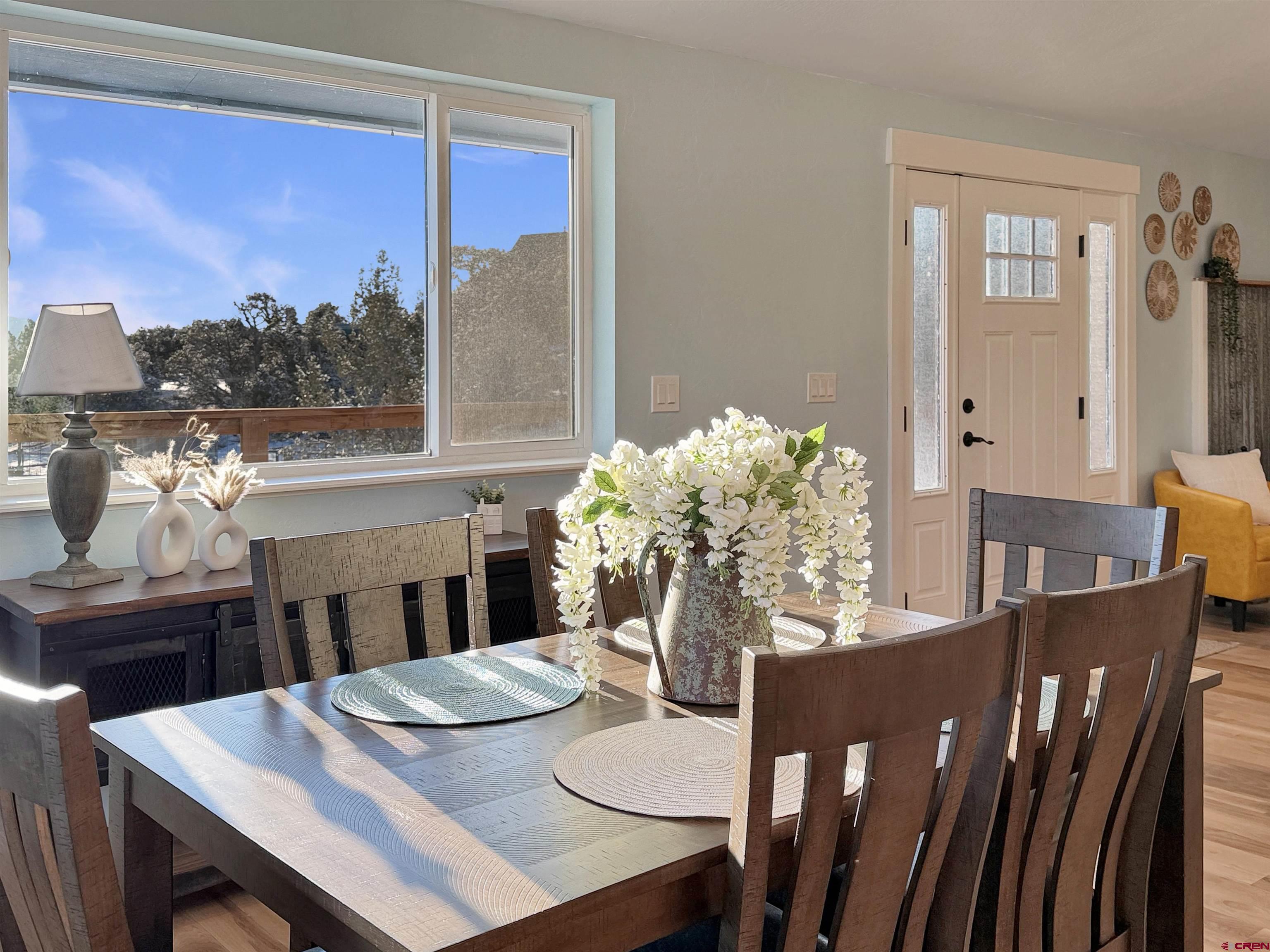 27425 Rd P.7 Dolores, CO 81323 - Photo 6 of 44 a view of a dining room with furniture window and wooden floor