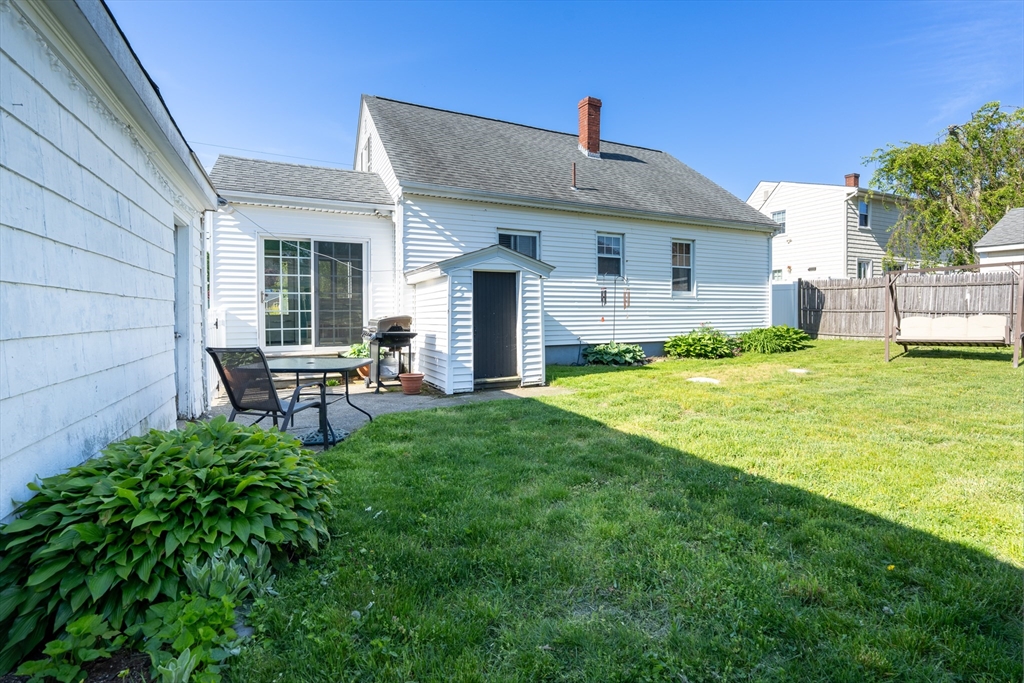110 James M Beardsworth Road Tiverton, RI 02878 - Photo 23 of 26 a backyard of a house with table and chairs