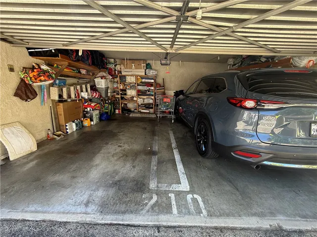 a view of a garage with parked cars