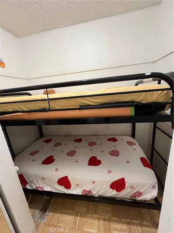 a bedroom with a bed and a white bed