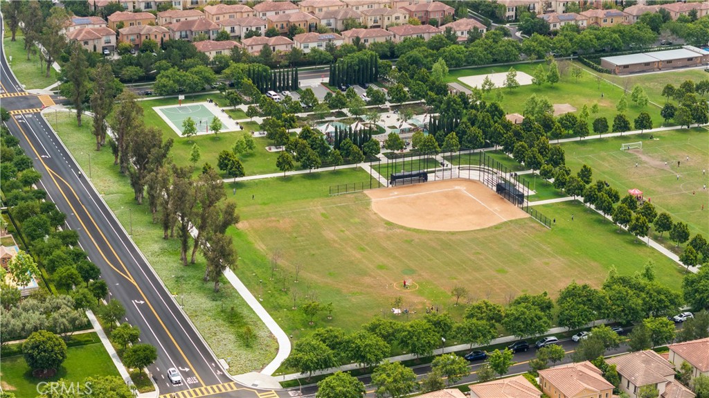 56 Cactus Flower Irvine, CA 92620 - Photo 4 of 4 an aerial view of residential houses with outdoor space and swimming pool