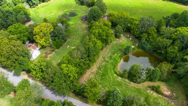 a backyard of a house with lots of green space