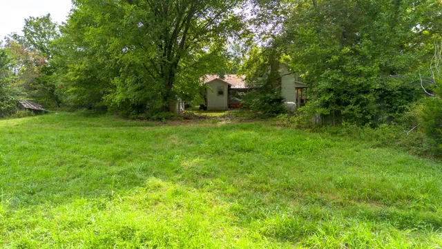 a view of swimming pool from a yard