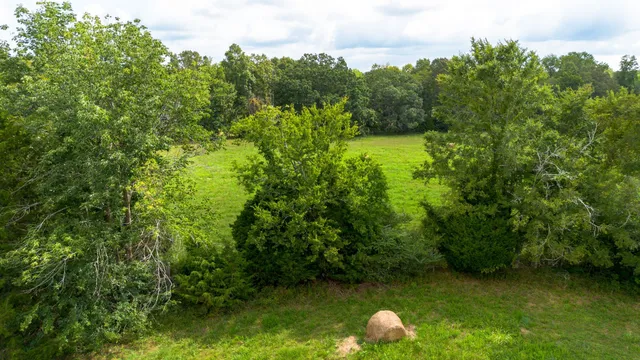 a view of a lake with a yard