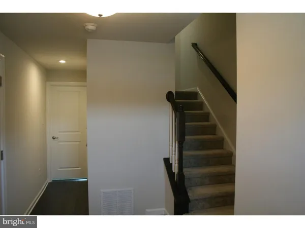 a view of entryway with stairs