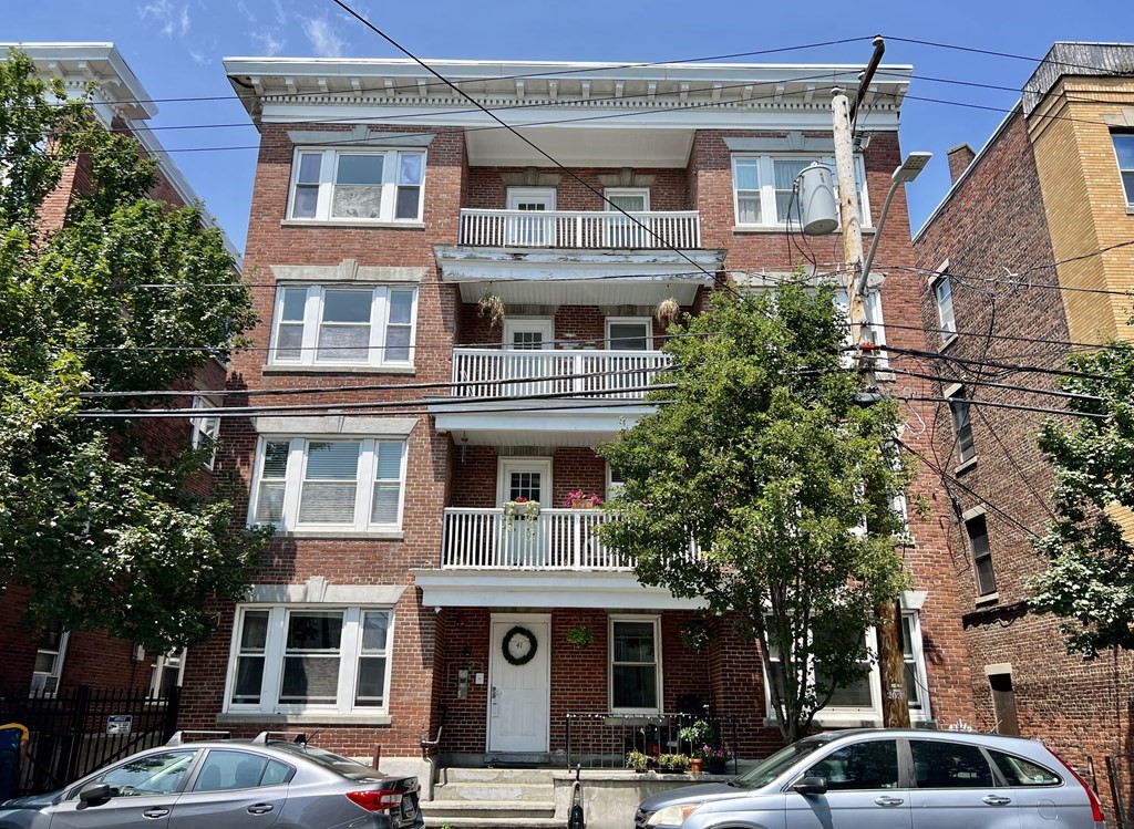 a front view of a building with street view