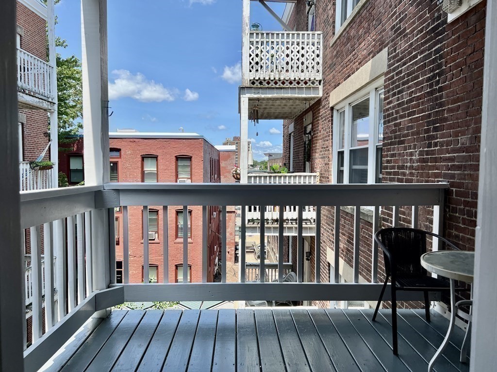41 Harbor Street, Unit 3 Salem, MA 01970 - Photo 14 of 20 a view of a brick building from a balcony