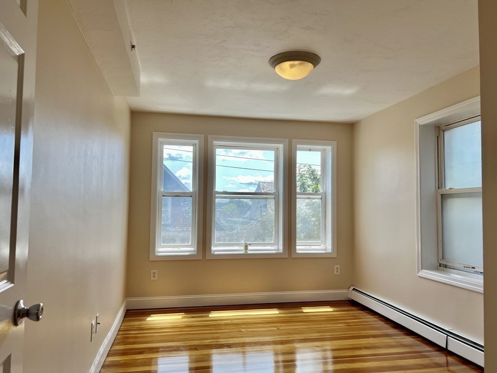 41 Harbor Street, Unit 3 Salem, MA 01970 - Photo 8 of 20 a view of a room with wooden floor and a window
