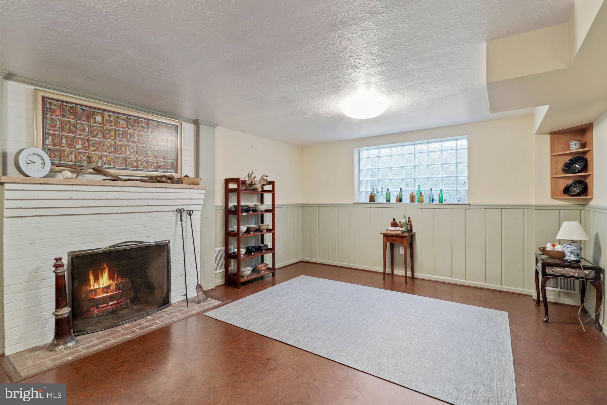 7201 Lenhart Drive Chevy Chase, MD 20815 - Photo 27 of 47 Rec room with wood-burning FP