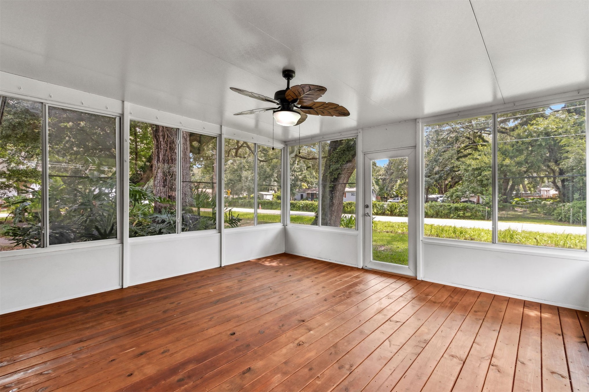 2441 Amelia Road Fernandina Beach, FL 32034 - Photo 3 of 36 a view of empty room with wooden floor and fan