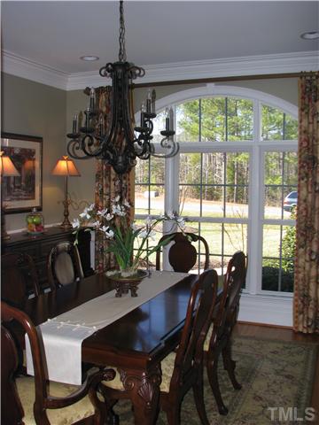 7300 Sparhawk Road Wake Forest, NC 27587 - Photo 6 of 12 3 price moldings, chair rail and wainscoting, custom windows and light, this lovely room will be just the place to entertain.