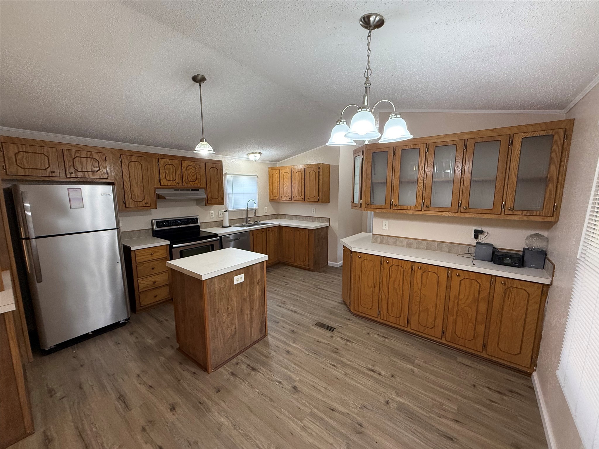 4813 Fm 357 Apple Springs Apple Springs, TX 75926 - Photo 13 of 32 a kitchen with granite countertop wooden floors stainless steel appliances and a counter space