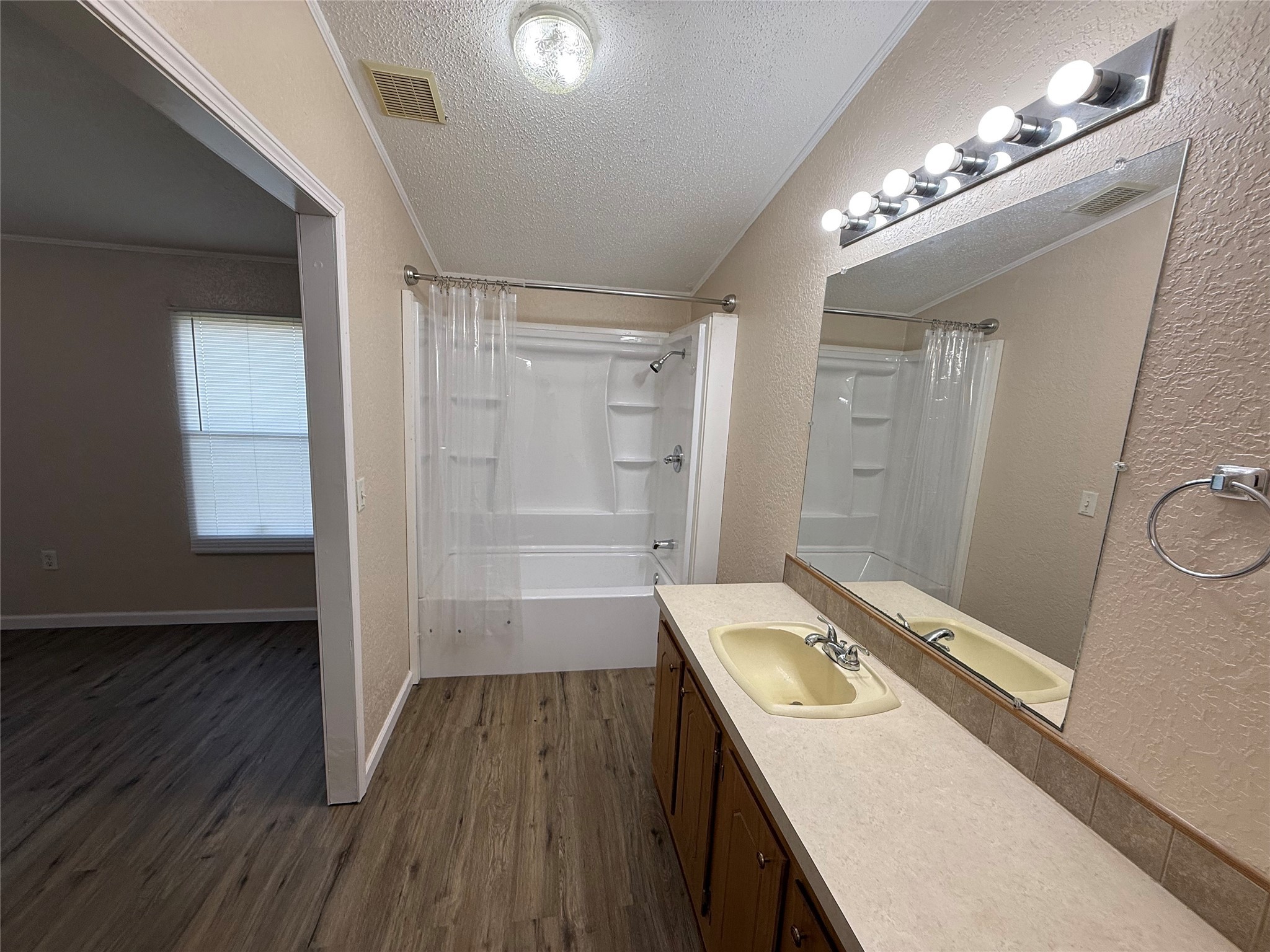 4813 Fm 357 Apple Springs Apple Springs, TX 75926 - Photo 16 of 32 a bathroom with a sink a toilet a mirror and window