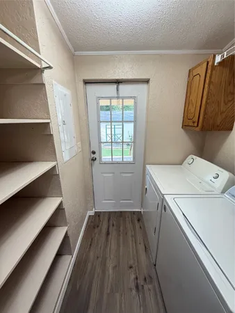 a view of storage and utility room with washer and dryer