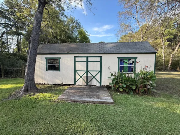 a view of a house with a garden