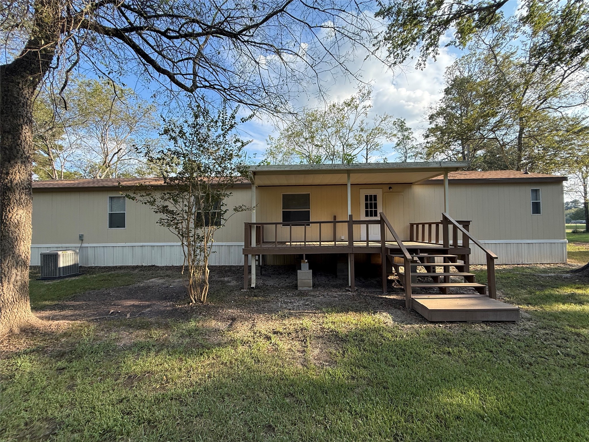 4813 Fm 357 Apple Springs Apple Springs, TX 75926 - Photo 5 of 32 a view of a house with a yard