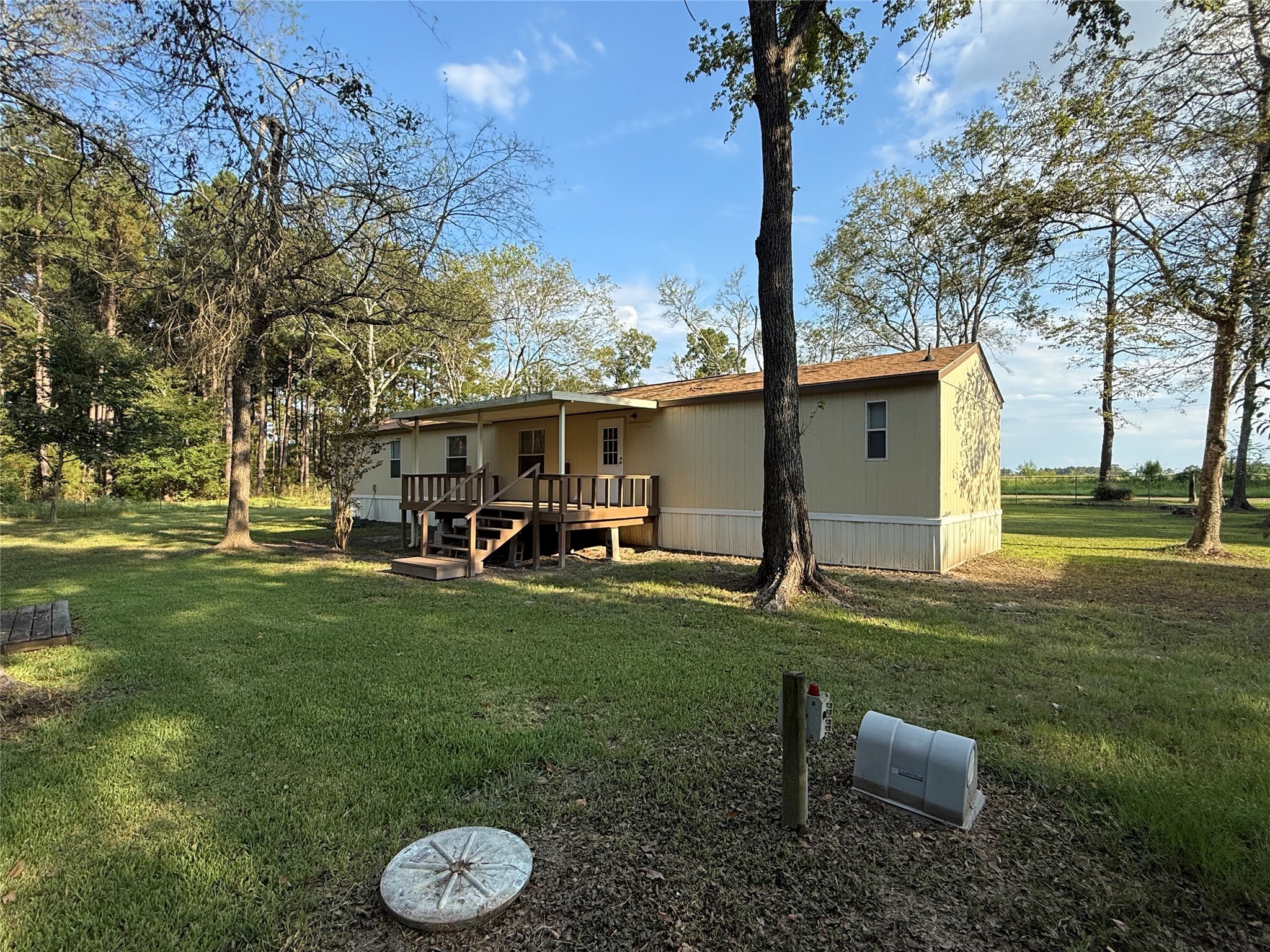 4813 Fm 357 Apple Springs Apple Springs, TX 75926 - Photo 6 of 32 a view of a chair and table in backyard of the house