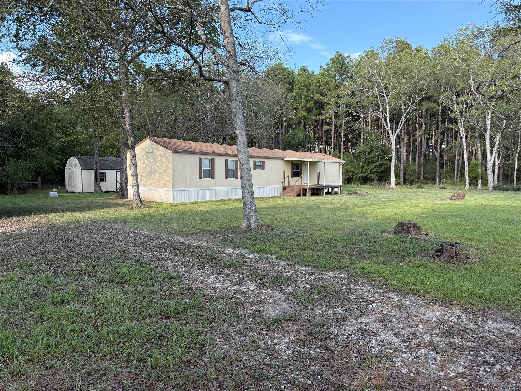 4813 Fm 357 Apple Springs Apple Springs, TX 75926 - Photo 10 of 32 a view of a house with yard and trees