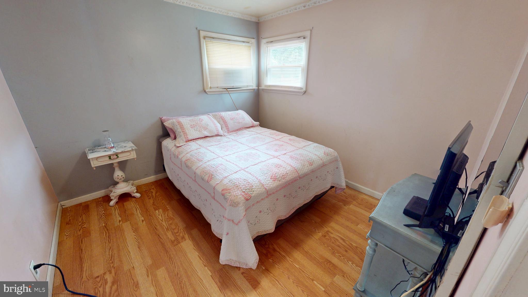 1401 Filbert Street Glassboro, NJ 08028 - Photo 11 of 18 a bed sitting in a bedroom next to a window