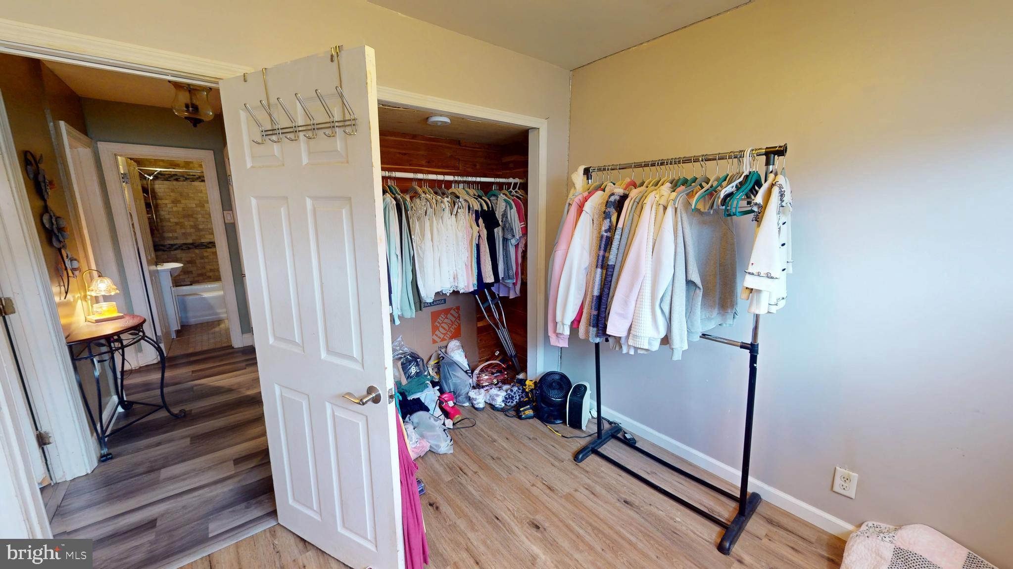 1401 Filbert Street Glassboro, NJ 08028 - Photo 13 of 18 a view of walk in closet with clothes and shoes