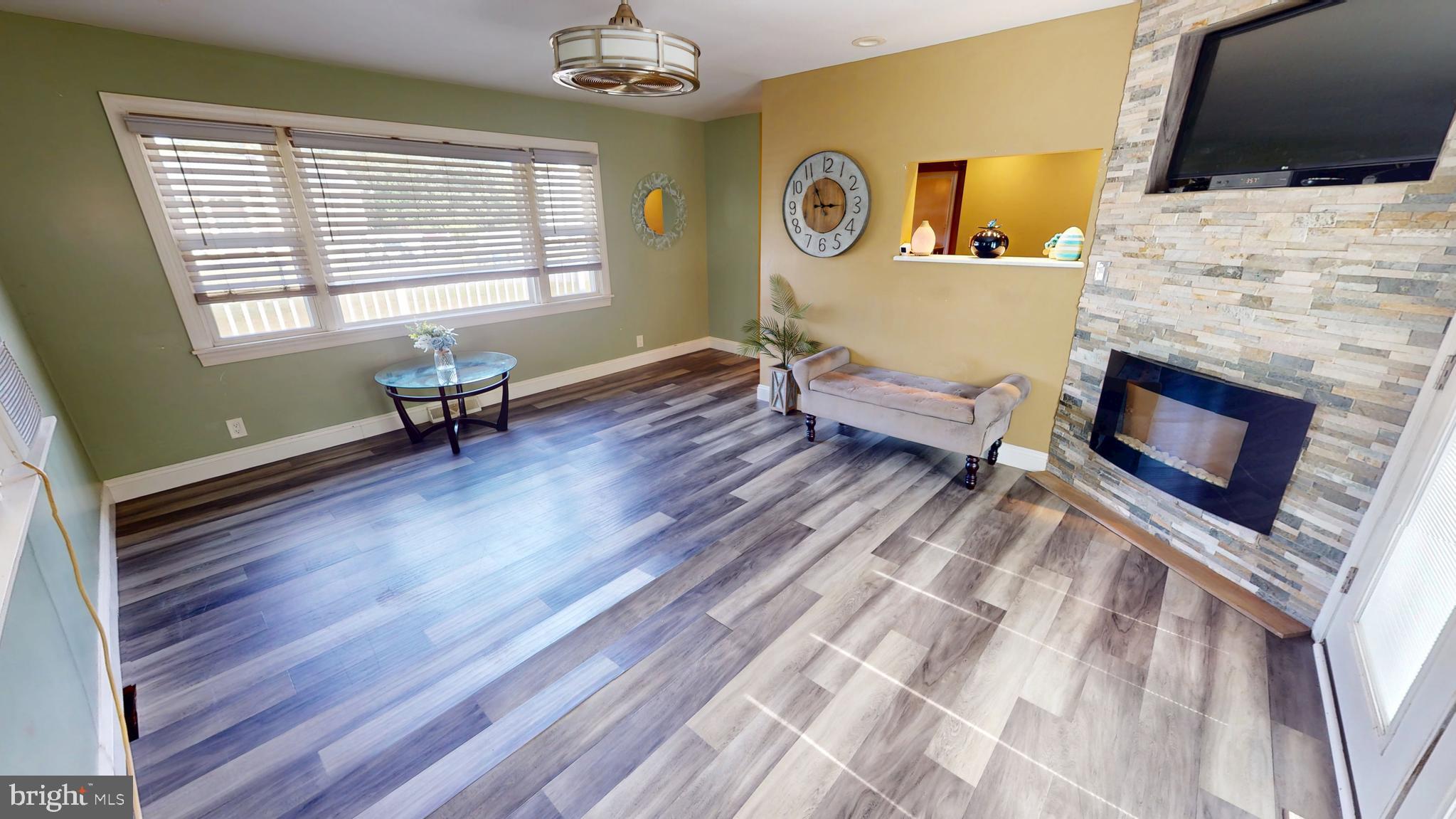 1401 Filbert Street Glassboro, NJ 08028 - Photo 4 of 18 a living room with furniture fireplace and flat screen tv