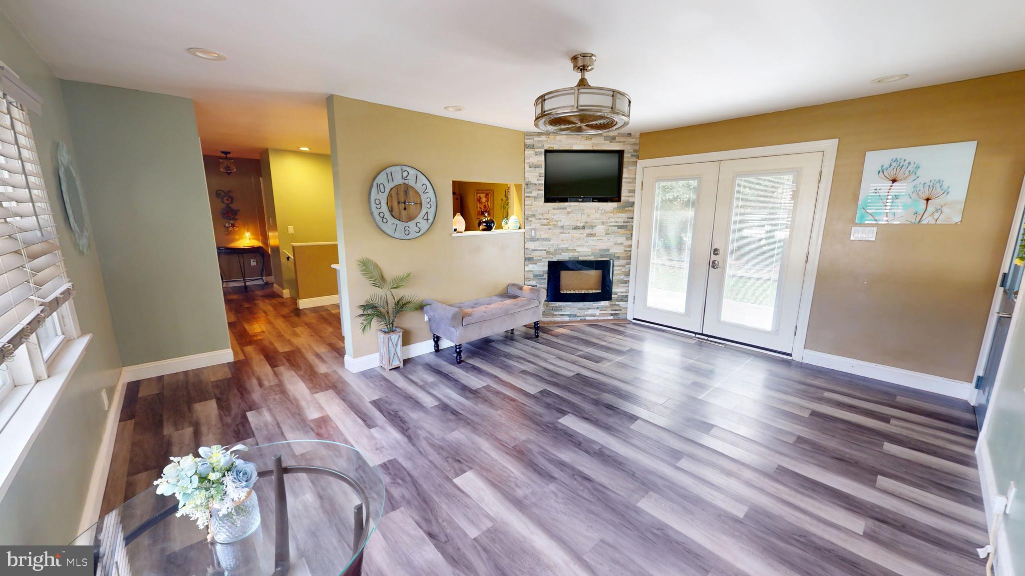 1401 Filbert Street Glassboro, NJ 08028 - Photo 5 of 18 a view of living room with furniture and fireplace