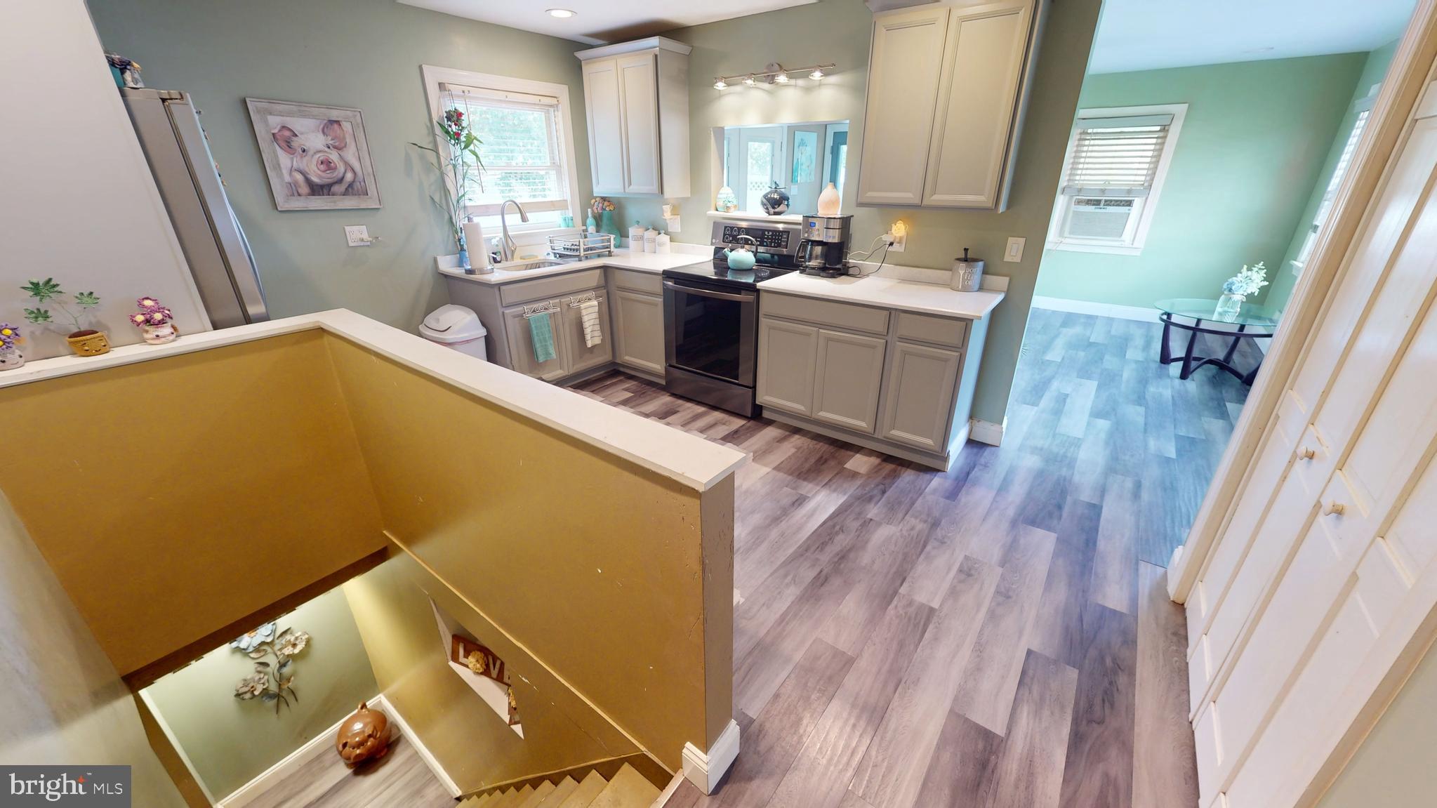 1401 Filbert Street Glassboro, NJ 08028 - Photo 8 of 18 a view of kitchen and sink with wooden floor
