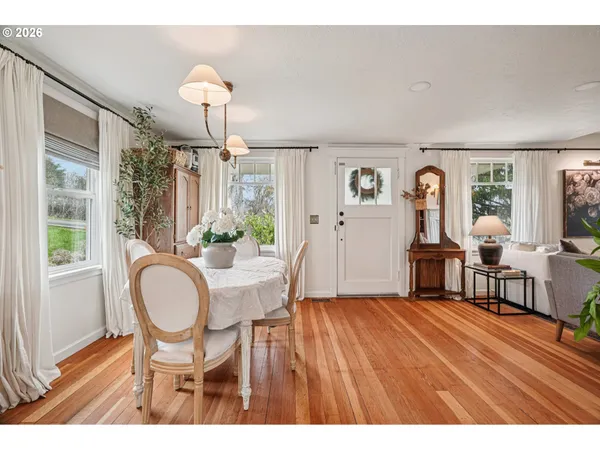 a view of a dining room with furniture window and wooden floor