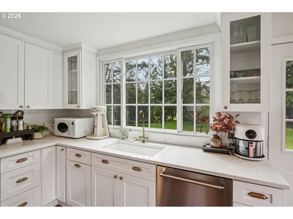 a kitchen with a sink and a window