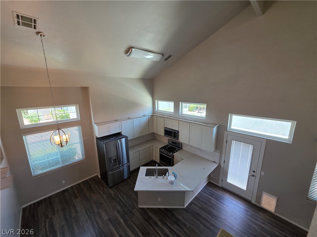 2275 Ramsgate Drive Henderson, NV 89074 - Photo 43 of 84 Lofty ceilings complement a bright kitchen space with durable flooring.