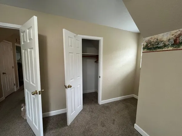 a view of a livingroom with a hallway