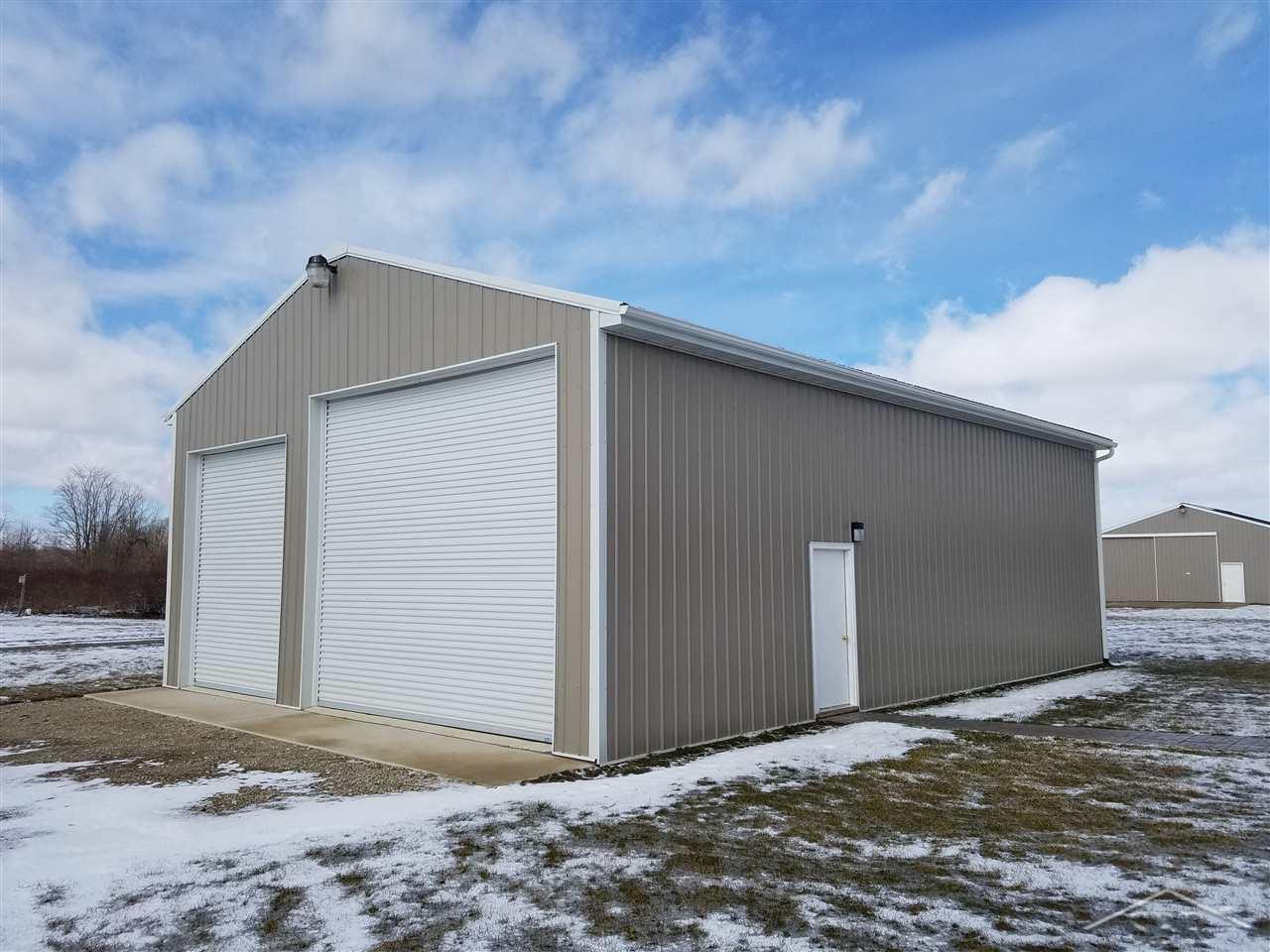 4580 West Gary Road Chesaning, MI 48616 - Photo 5 of 32 Built in 2015, 6' Concrete floors, water and 100amp electrical service, 14 foot doors. Cement approach. Separate drive from house.