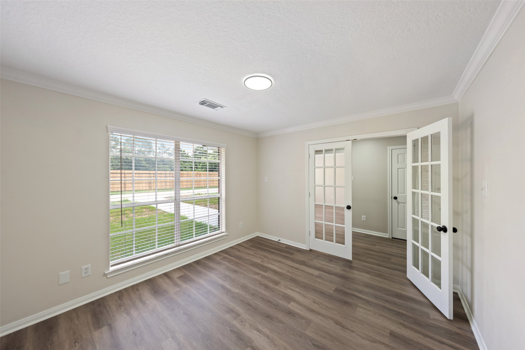 14989 Old Humble Pipeline Road Conroe, TX 77302 - Photo 6 of 33 Notice the French doors.