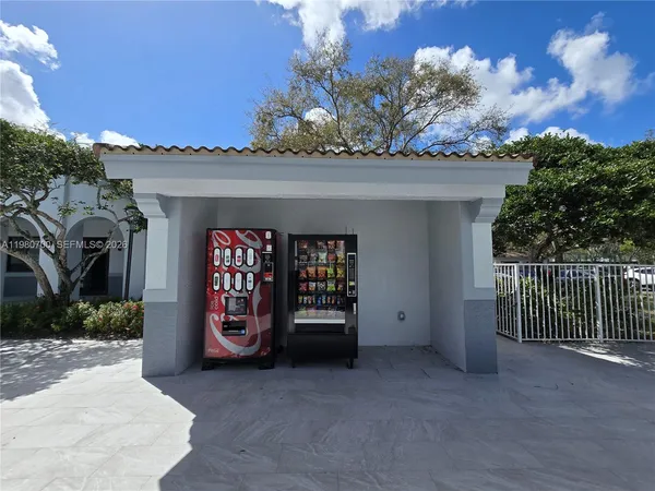 a view of an entrance to house with yard and hallway
