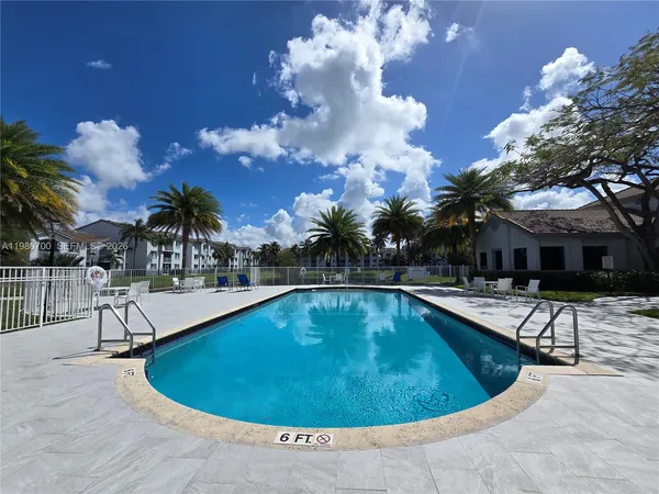 a view of a swimming pool with a patio