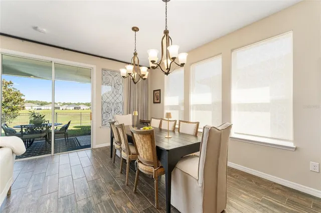 a bathroom with a granite countertop sink double vanity and a mirror