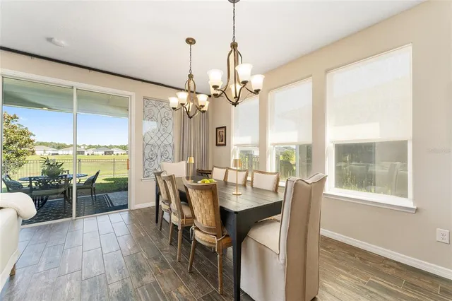 a bathroom with a granite countertop double vanity sink and a mirror