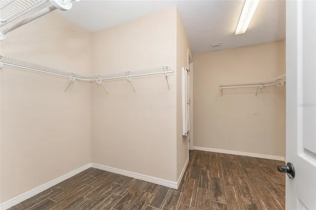a view of a house with pool and ocean view