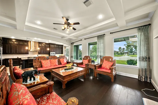 a living room with furniture fireplace and flat screen tv