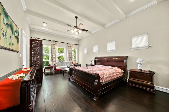 a bedroom with a bed dresser and a window