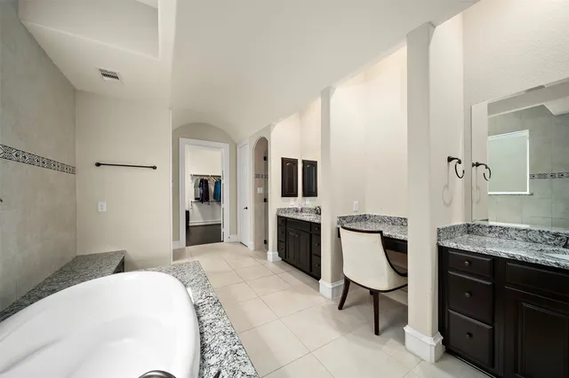 a bedroom with a bed and a television in it