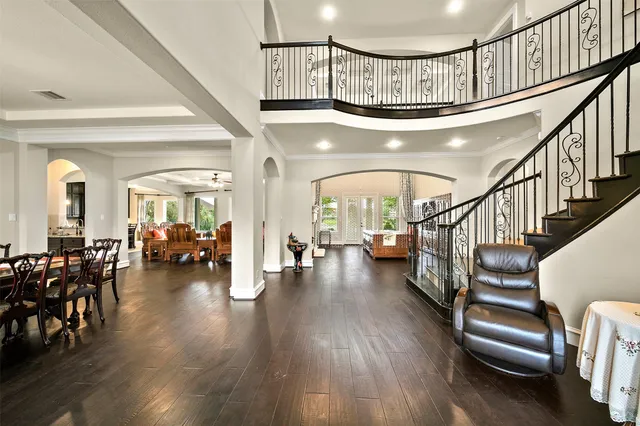 a view of entryway livingroom and hall with wooden floor