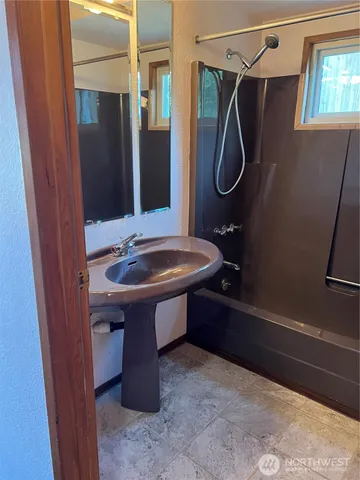 a bathroom with a sink and a mirror