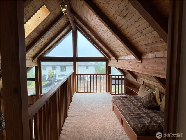 a view of balcony with wooden floor