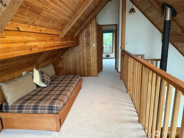 a view of balcony with wooden floor