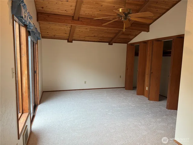 a view of a room with wooden walls