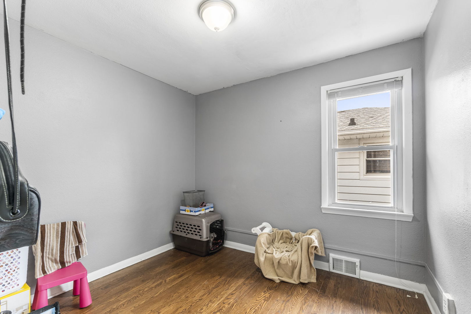 208 South Reed Street Joliet, IL 60436 - Photo 11 of 18 a living room with furniture and a window